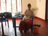 Recycling plastic. Cutting plastic stuff into small tiny pieces. We will make a pillow out of it.