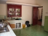 kitchen: entrance door, fridge