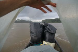 rain made this trip real fun! the trash backs in front of the boat are actually two Peruvian boys