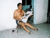 Edgar loves to read newspaper half-naked, sitting in front of his house in the evenings