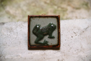 Ceramic decoration with a frog image